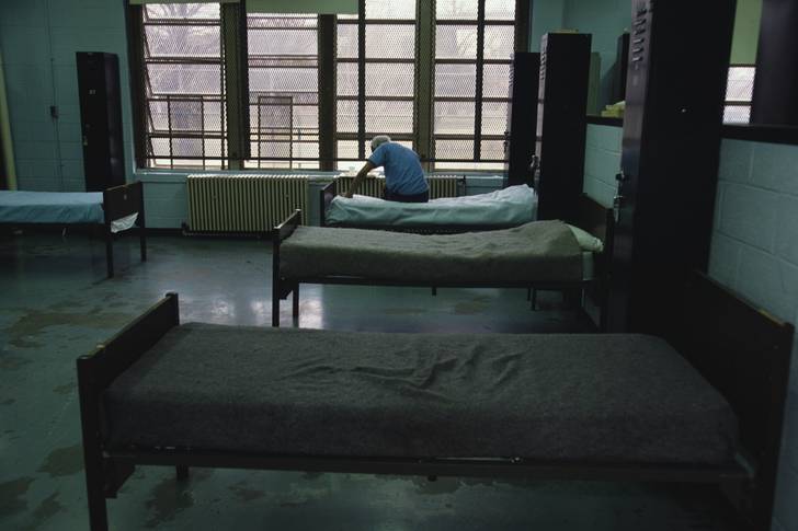 A man rests at the Charles H. Gay Shelter Care Center for Men on Ward's Island in New York City.
